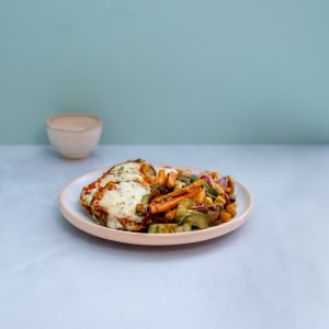Milanesas de zapallitos napo con vegetales al horno